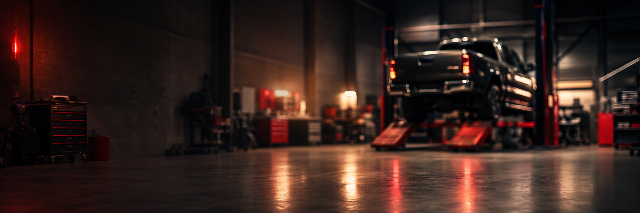 Blurred Toyota workshop background with Hilux on ramp for repair outcome quote card
