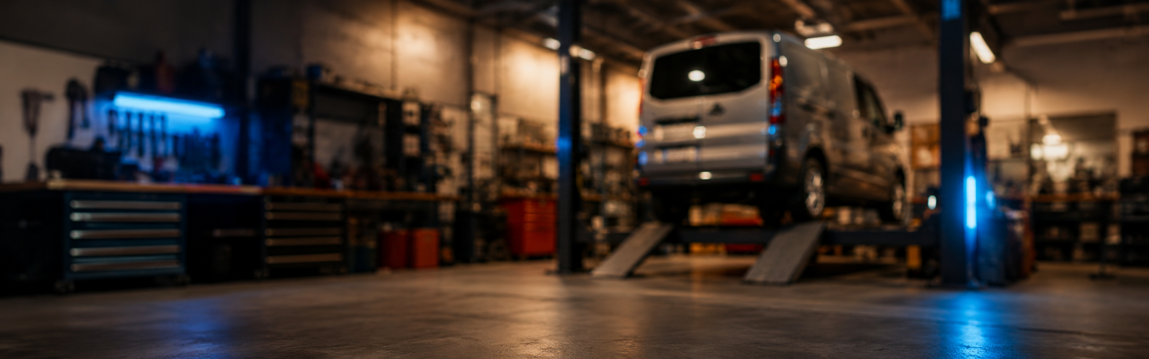 Blurred Vauxhall workshop background with Vivaro on ramp for repair outcome quote card